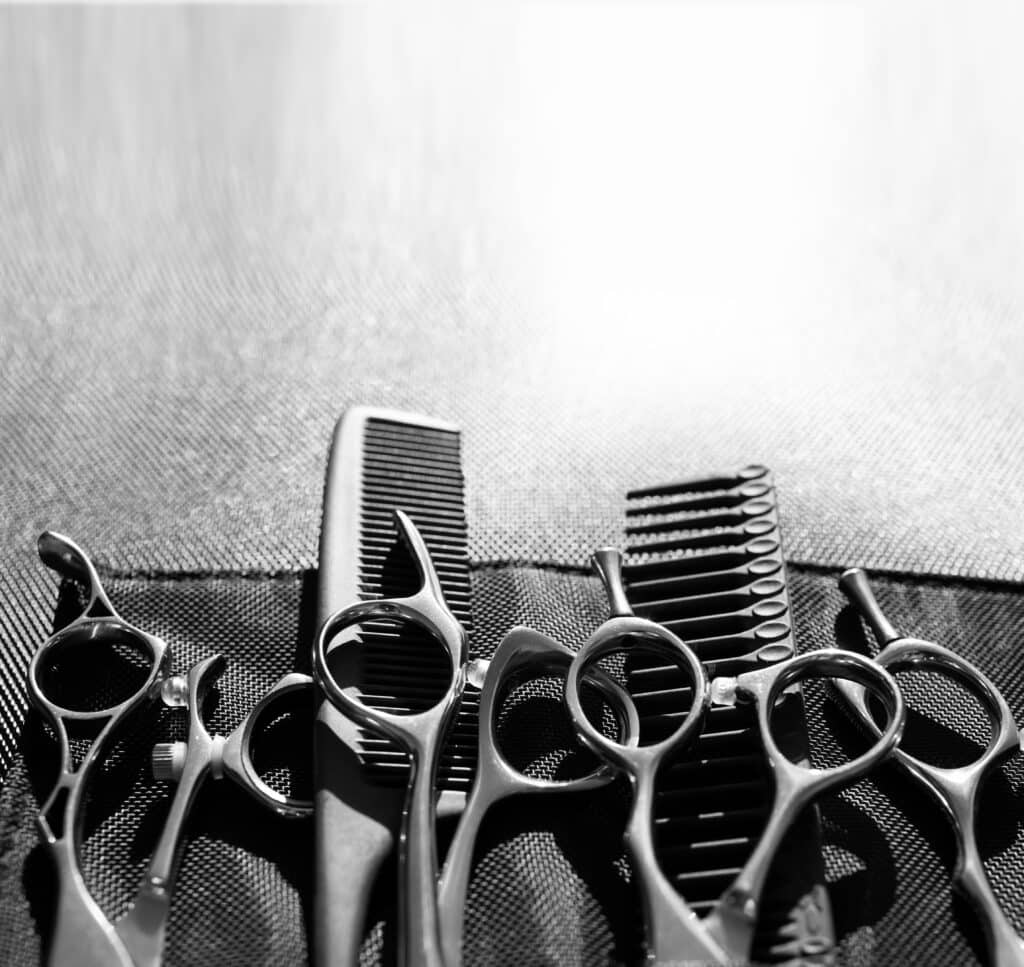 Stylish professional barber scissors and combs, hairdresser salon concept, hairdressing tool set. Haircut accessories